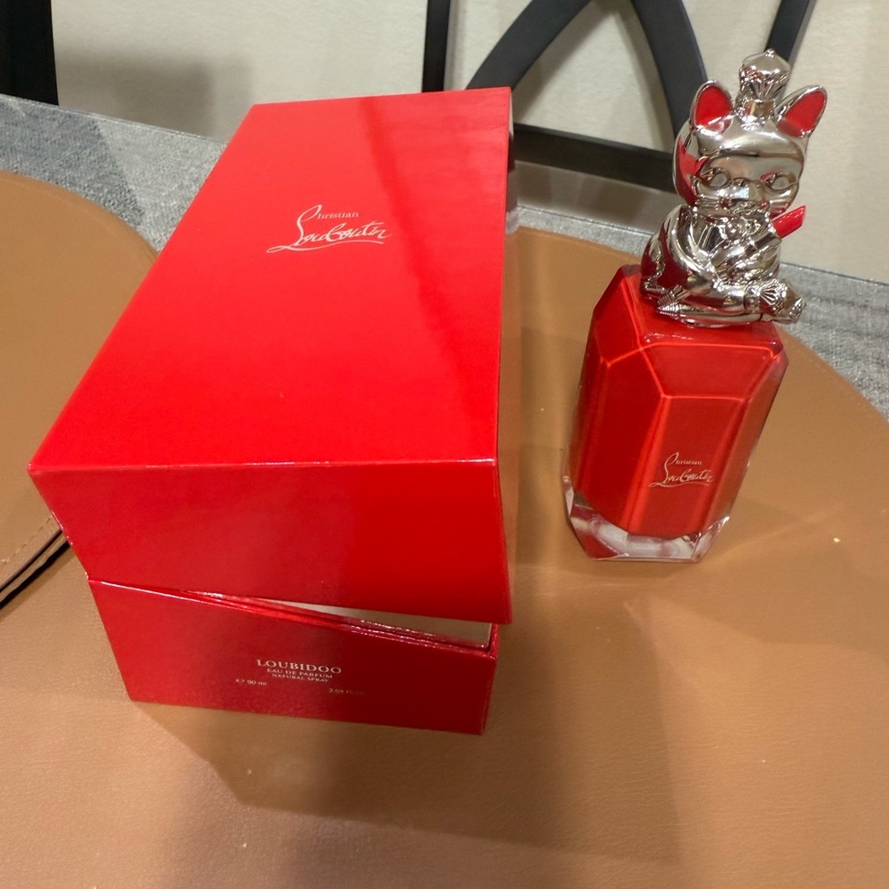 Christian Louboutin Red Bottle with Silver Cat Top